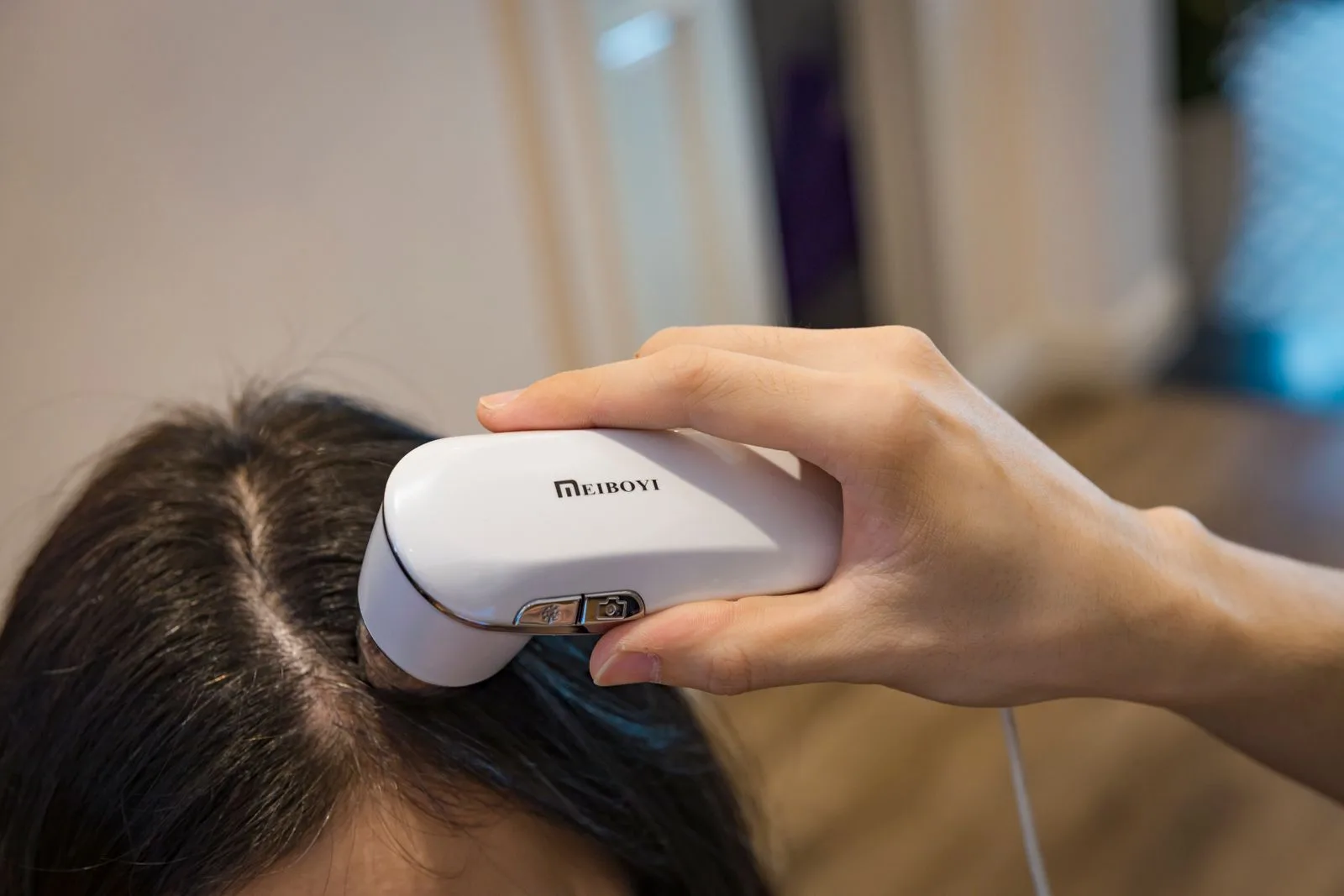 Trichoscopy device examining a patient's scalp before PRP hair treatment in Malta